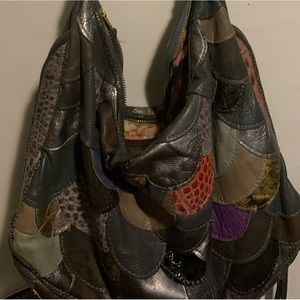 Maya Moon hand made purse. Adjustable strap. Adjustable width with zipper.